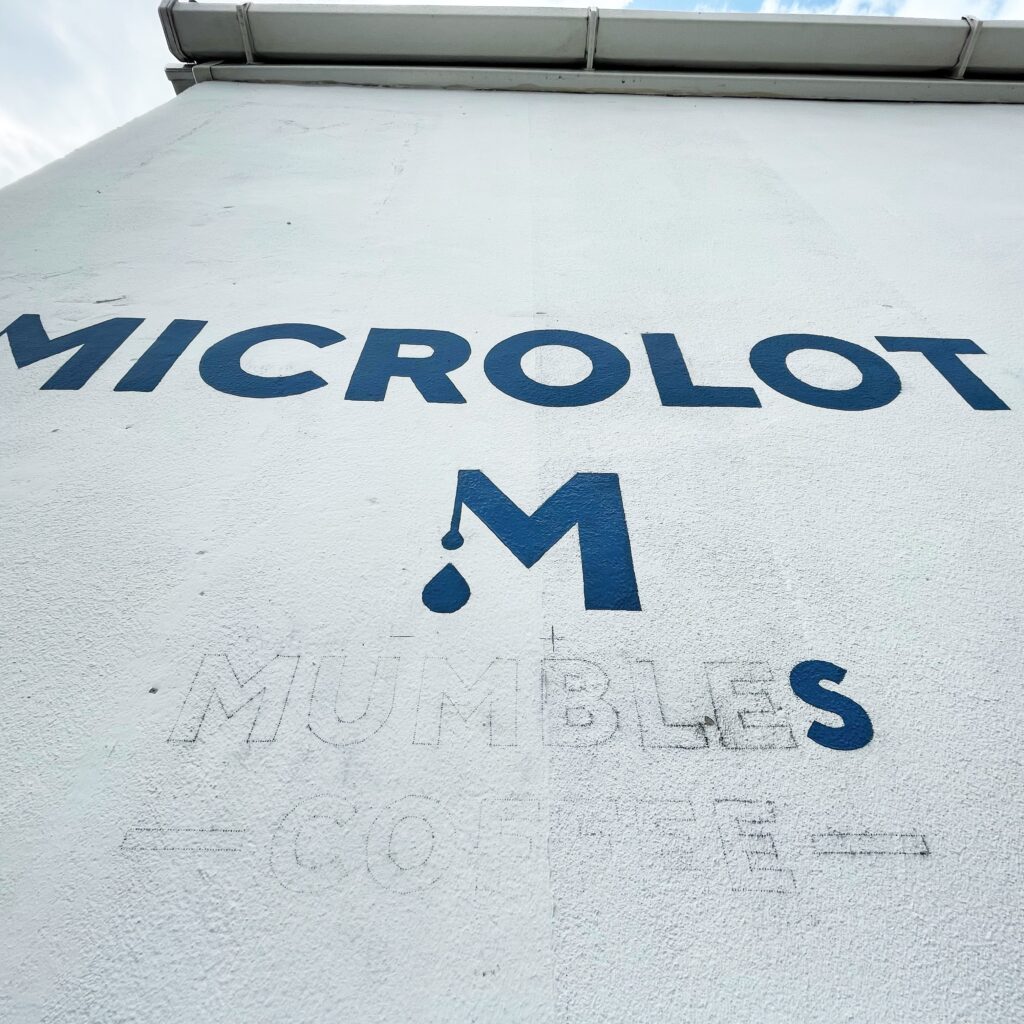 Work in progress of sign-painting on Microlot