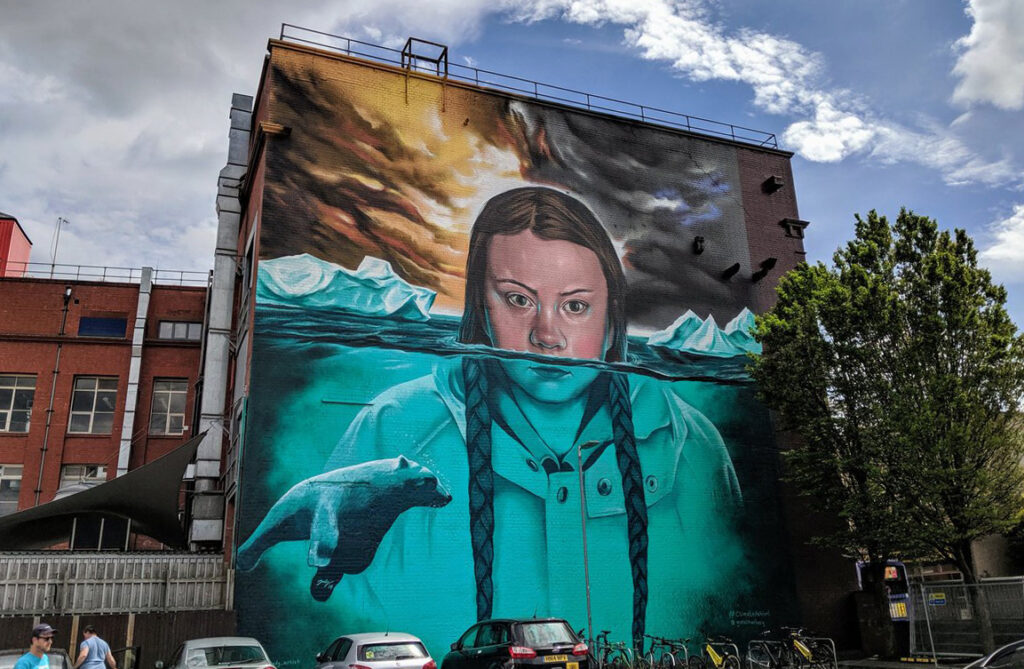 Graffiti mural painting of Greta Thunberg half underwater